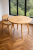 Solid round oak table.png